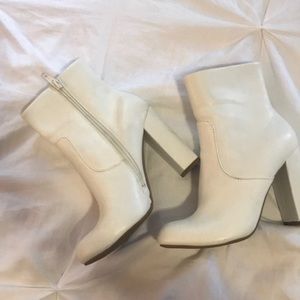 White leather ankle booties